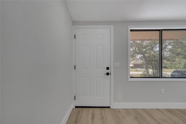 doorway to outside with light hardwood / wood-style flooring