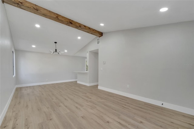 unfurnished living room with vaulted ceiling with beams, light hardwood / wood-style flooring, and an inviting chandelier