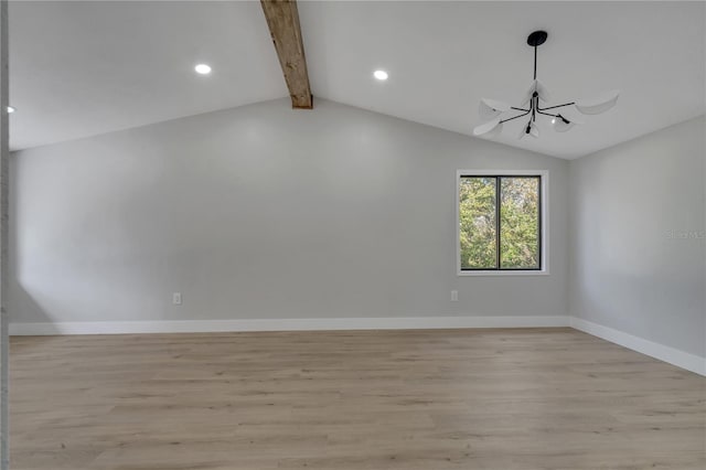 spare room featuring vaulted ceiling with beams, light hardwood / wood-style flooring, and a chandelier