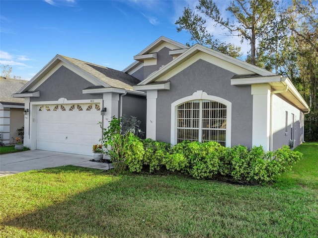 view of front facade featuring a front yard and a garage