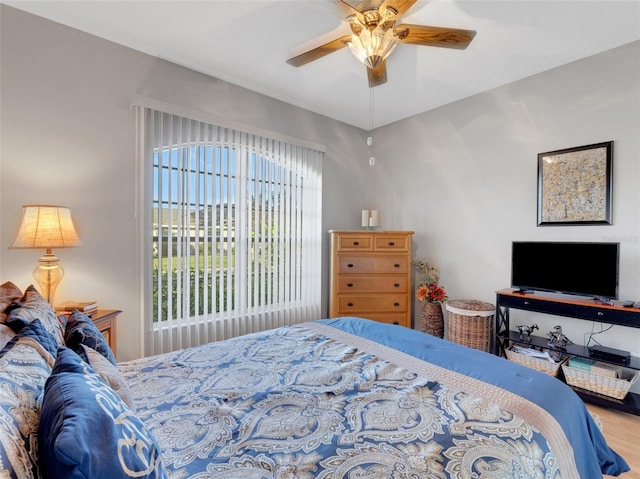 bedroom with ceiling fan and hardwood / wood-style floors