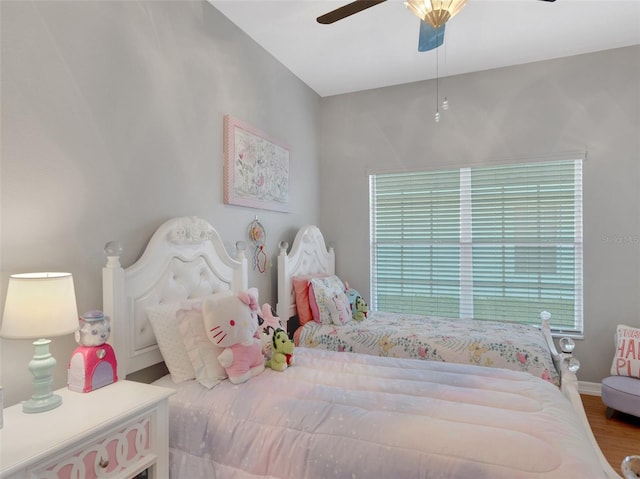 bedroom with ceiling fan and hardwood / wood-style floors