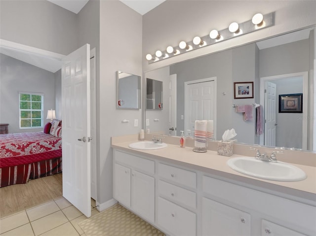 bathroom with tile patterned flooring and vanity