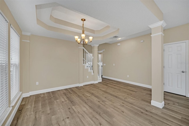 interior space featuring hardwood / wood-style floors, an inviting chandelier, and a wealth of natural light