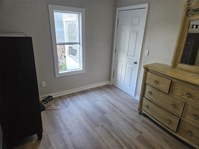 bedroom with light wood-type flooring