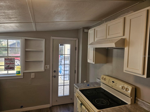 kitchen featuring electric stove, dark wood-type flooring, and lofted ceiling