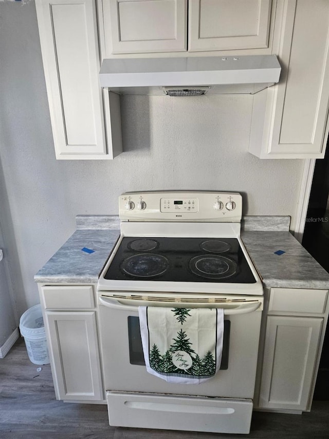 kitchen featuring dark hardwood / wood-style flooring, white cabinetry, and white range with electric stovetop