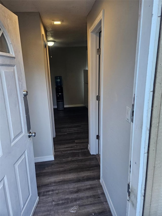 hall with dark hardwood / wood-style floors