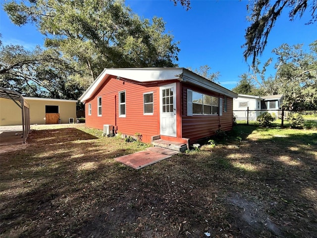 back of property with central AC unit