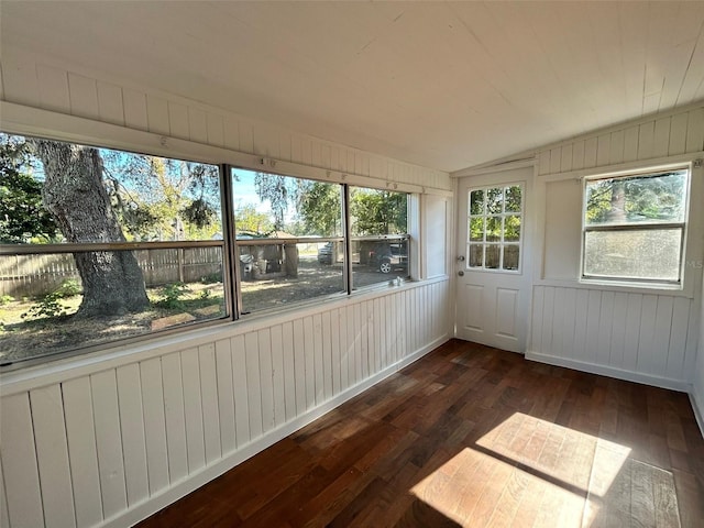 unfurnished sunroom featuring lofted ceiling