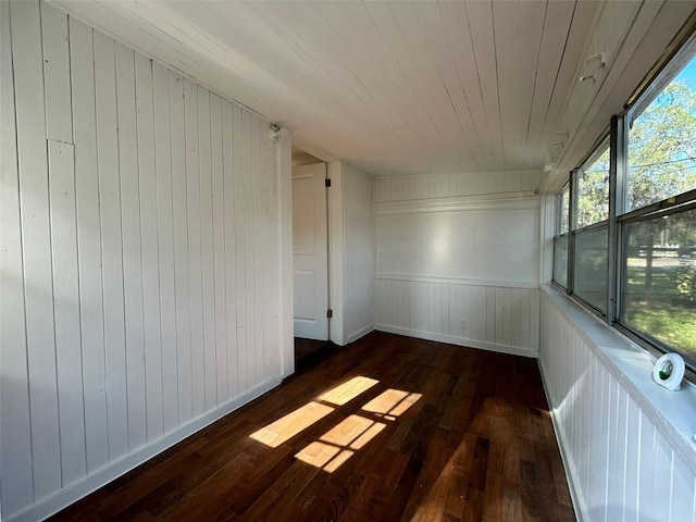 unfurnished sunroom with wooden ceiling