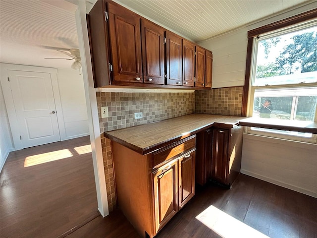 kitchen with decorative backsplash, ceiling fan, and dark hardwood / wood-style flooring