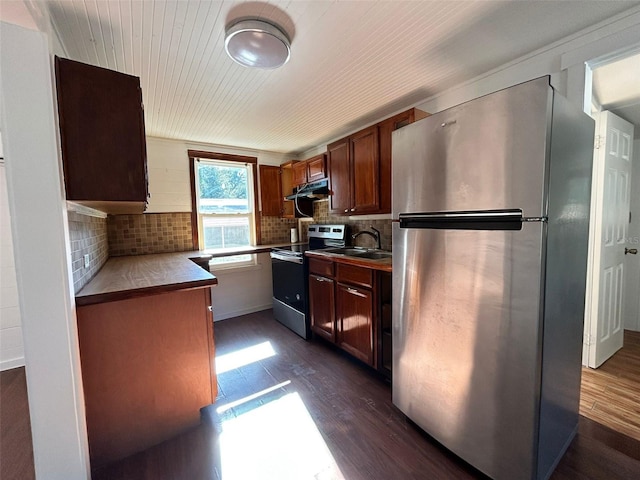 kitchen featuring dark hardwood / wood-style floors, sink, stainless steel appliances, and tasteful backsplash