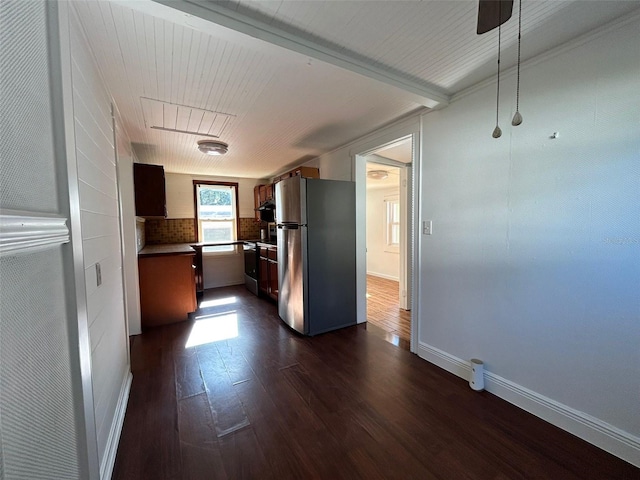 kitchen featuring decorative backsplash, dark hardwood / wood-style flooring, and stainless steel appliances