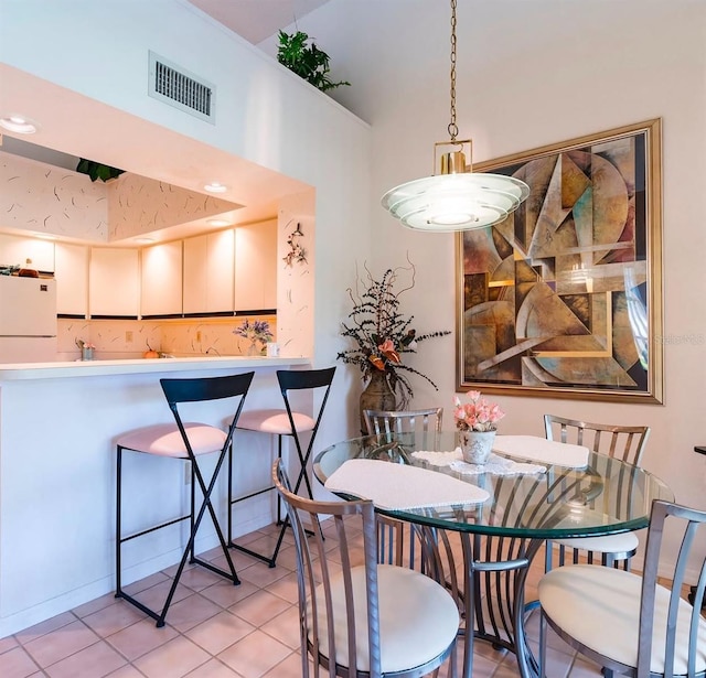 dining space with light tile patterned floors