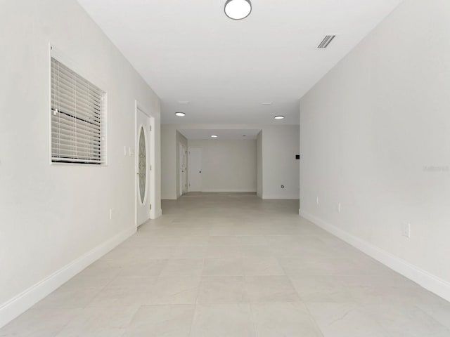 hallway featuring light tile patterned floors