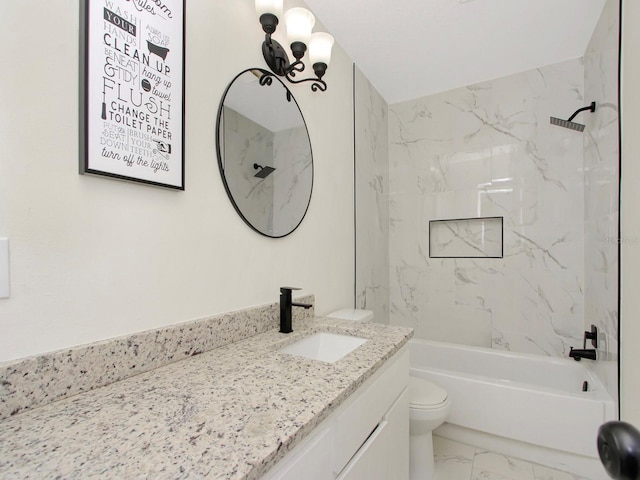 full bathroom featuring vanity, tiled shower / bath combo, and toilet