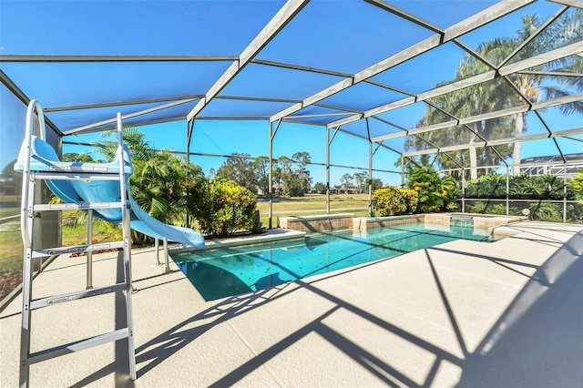 view of pool featuring a patio, a lanai, and a water slide