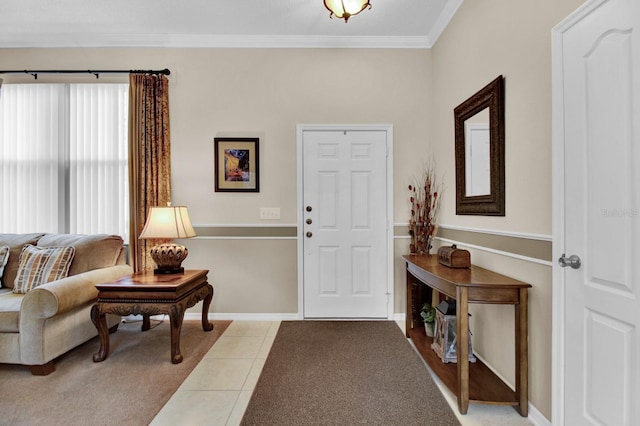 carpeted entryway featuring crown molding