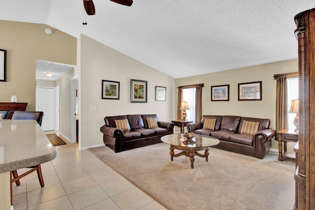 living room featuring ceiling fan, a healthy amount of sunlight, light carpet, and vaulted ceiling