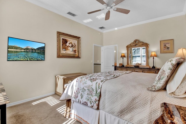 carpeted bedroom featuring ceiling fan and ornamental molding