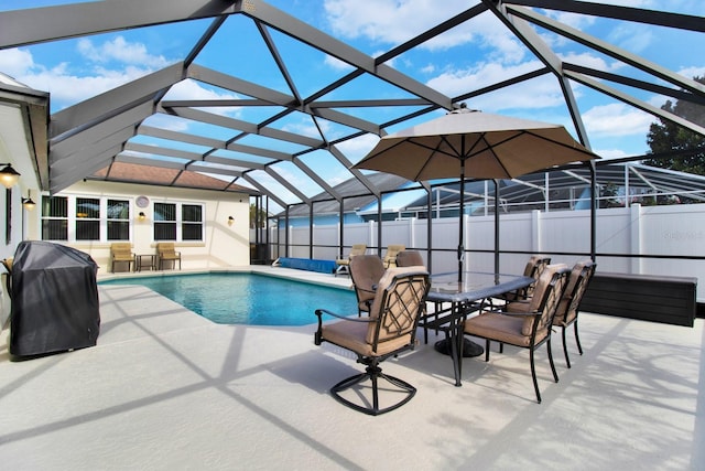 view of swimming pool with glass enclosure, a patio area, and a grill