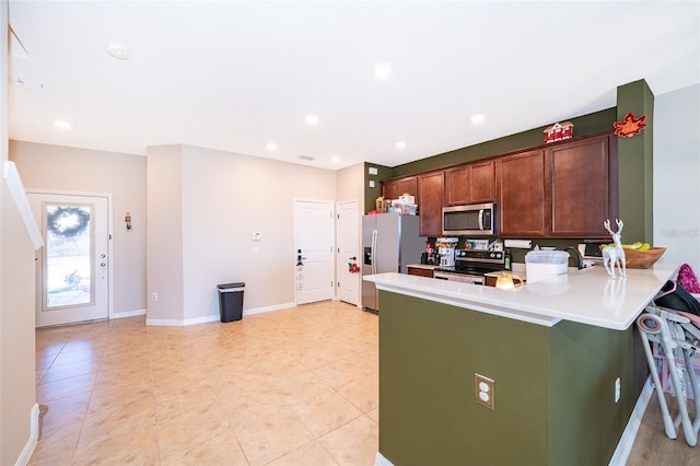 kitchen featuring kitchen peninsula and appliances with stainless steel finishes