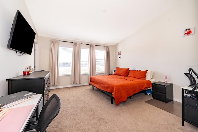 bedroom with light carpet and vaulted ceiling