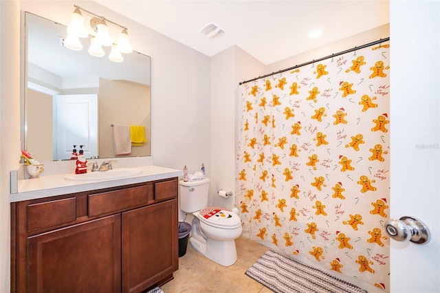 bathroom with tile patterned floors, vanity, and toilet