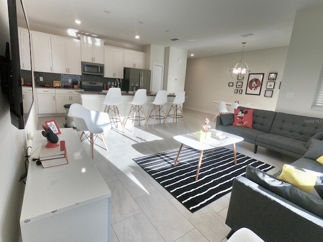 living room with an inviting chandelier