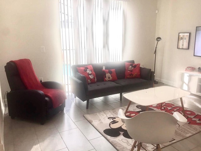 living room featuring a healthy amount of sunlight and light tile patterned floors