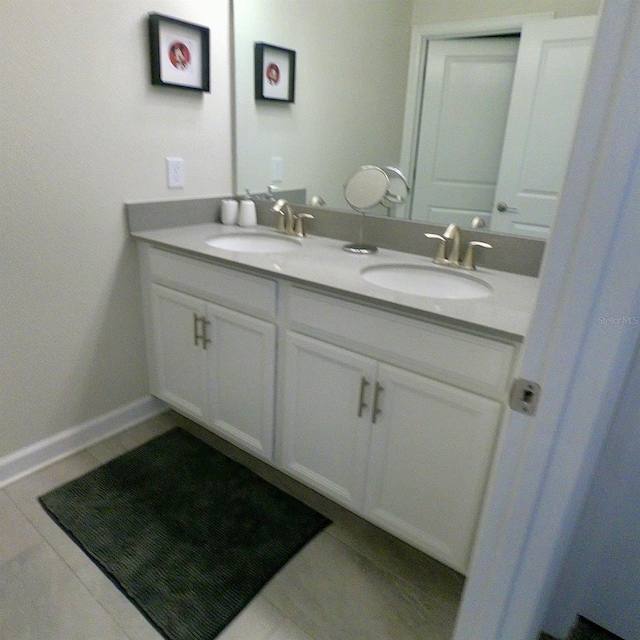 bathroom featuring tile patterned floors and vanity