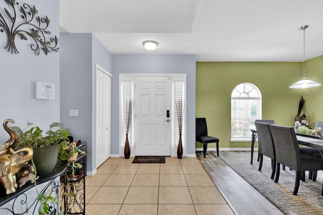 entryway with light tile patterned floors