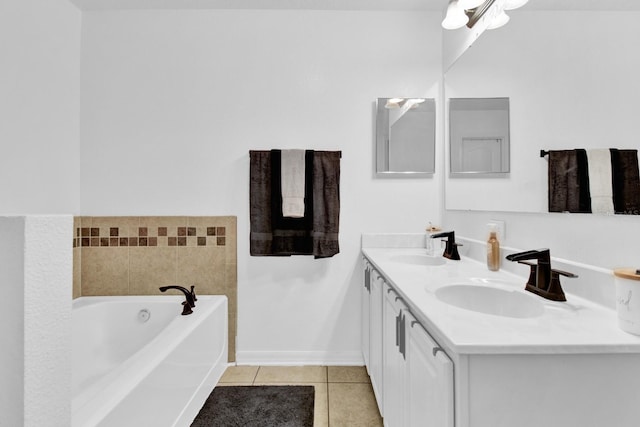 bathroom featuring tile patterned flooring, vanity, and a bathing tub