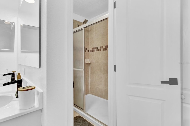 bathroom featuring vanity and walk in shower