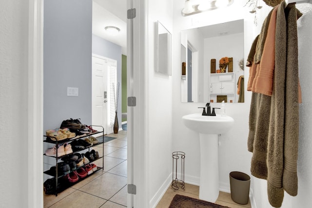 bathroom with tile patterned floors