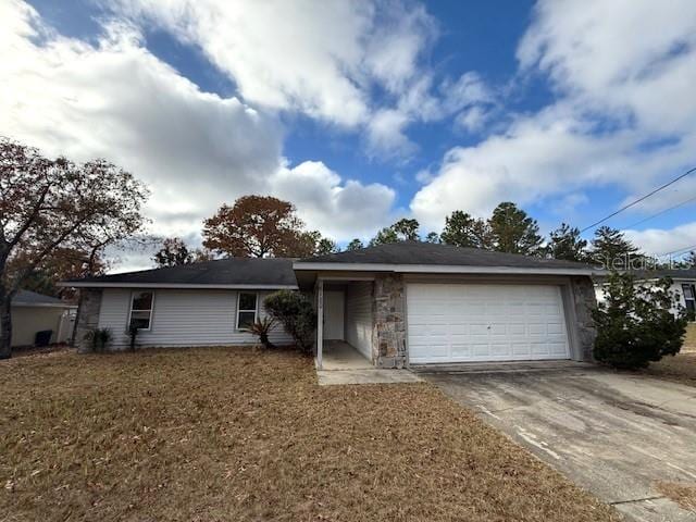 ranch-style home featuring a garage