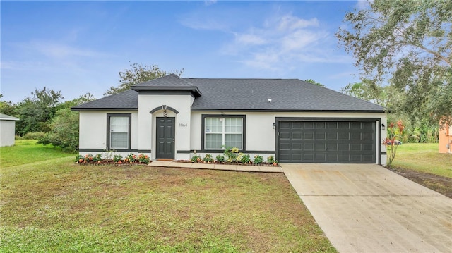 single story home featuring a garage and a front lawn