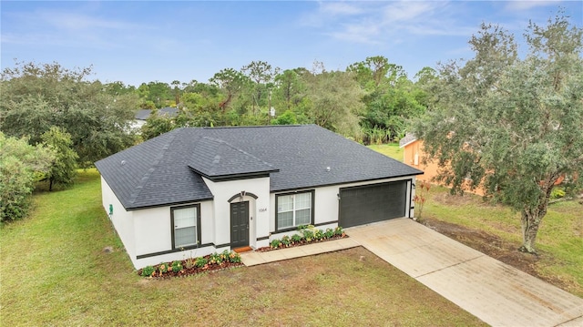 view of front of house featuring a garage and a front yard