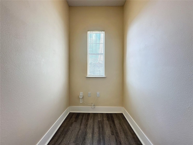 laundry area featuring dark hardwood / wood-style floors