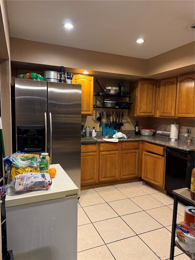 kitchen with brown cabinets, stainless steel refrigerator with ice dispenser, dark countertops, recessed lighting, and dishwasher