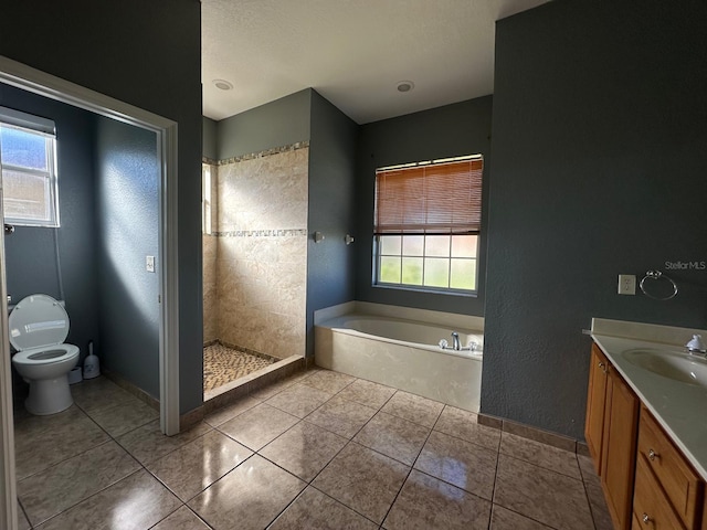 full bathroom featuring tile patterned flooring, vanity, toilet, and independent shower and bath