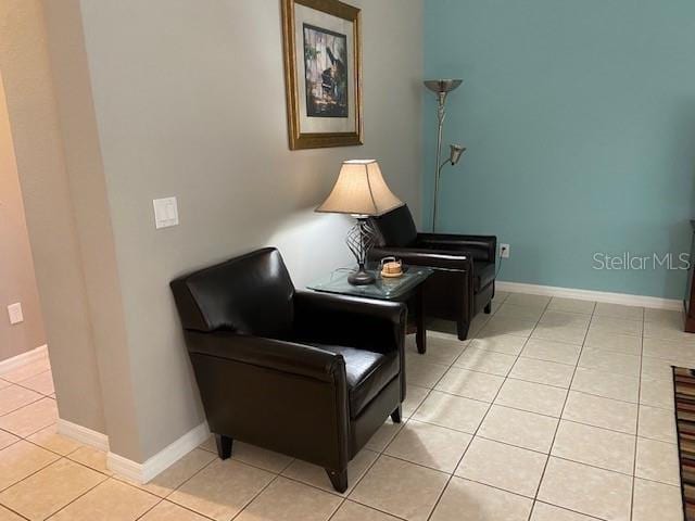 living area featuring light tile patterned flooring