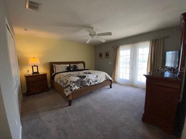 bedroom with dark carpet and ceiling fan