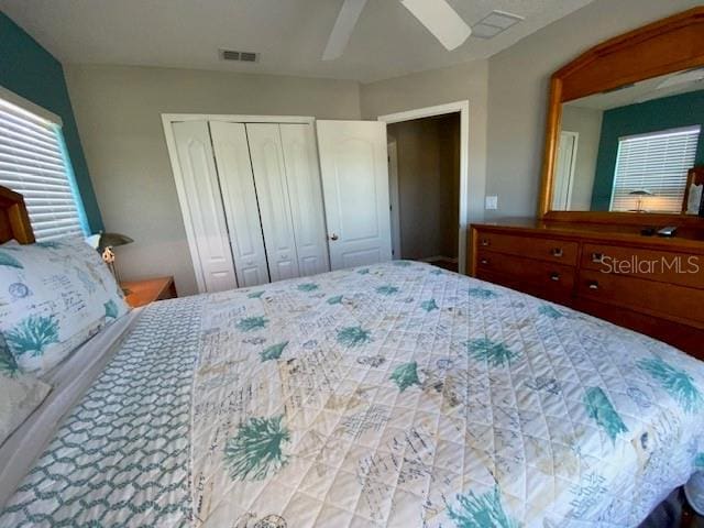 bedroom featuring ceiling fan and a closet