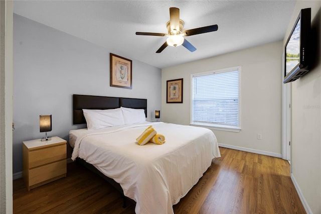 bedroom featuring hardwood / wood-style flooring and ceiling fan