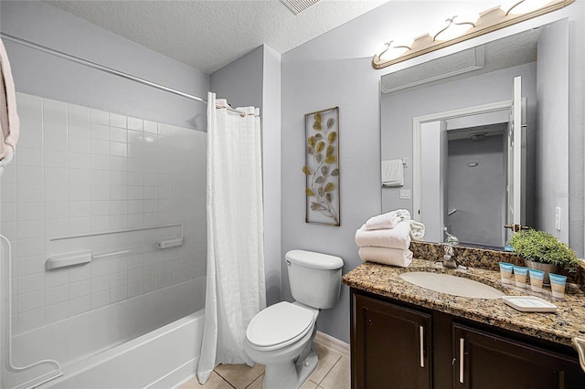 full bathroom featuring tile patterned flooring, shower / bath combination with curtain, a textured ceiling, toilet, and vanity