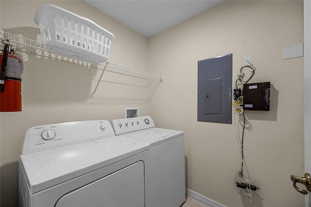 clothes washing area featuring washing machine and dryer and electric panel