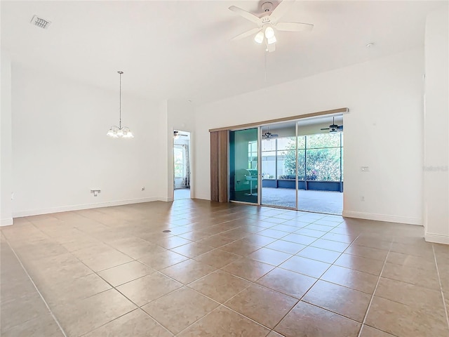 tiled empty room featuring ceiling fan with notable chandelier