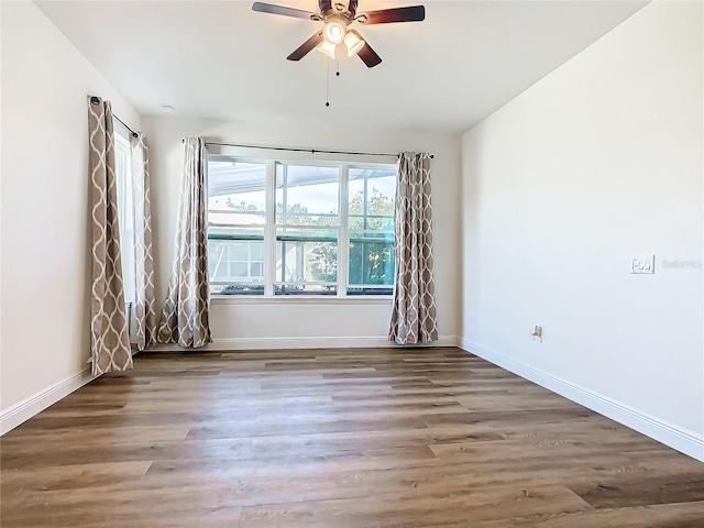 unfurnished room with wood-type flooring and ceiling fan